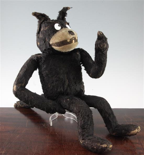 An early black plush straw filled model of Felix The Cat, 18in.